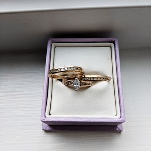 One engagement ring and two dimond bands